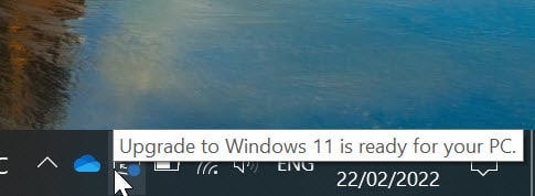 Windows 10 screen with a blue circle in the Updates button. The mouse is pointing over updates button and a notification saying "Upgrade to Windows 11 is ready for your PC"